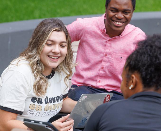 CU Denver students outside working together