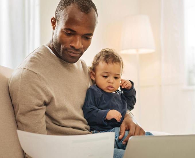 CU Denver online student parent with his child