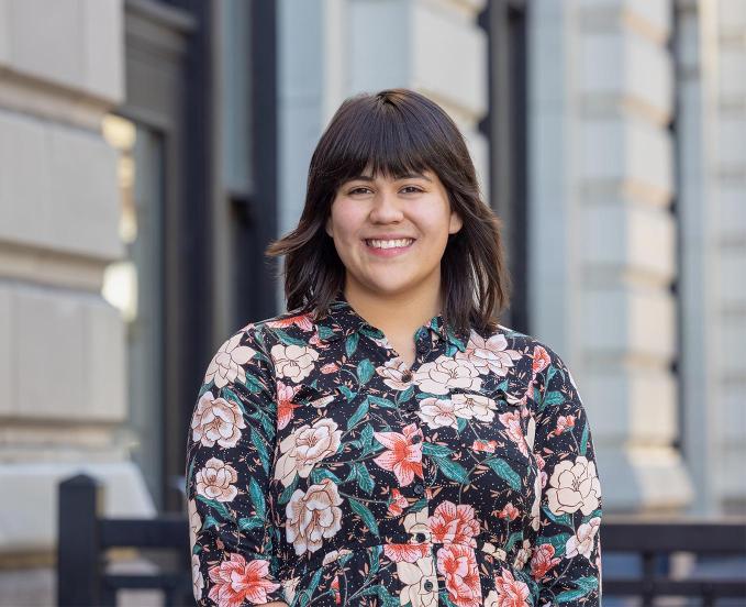 CU Denver HDFR student, Kiara M, smiling while standing outside in front of a building