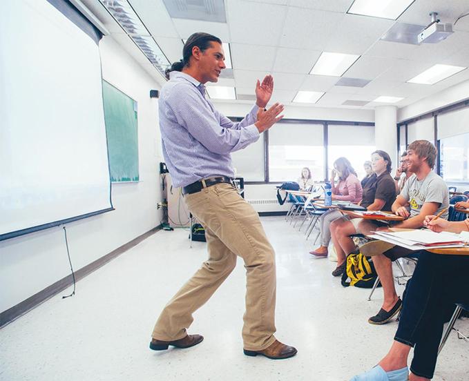 CU Denver professor in classroom speaking to students