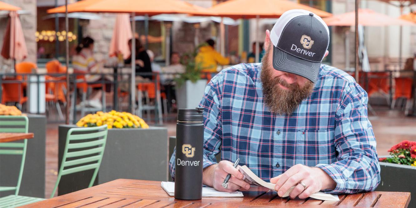 CU Denver student working outside in downtown
