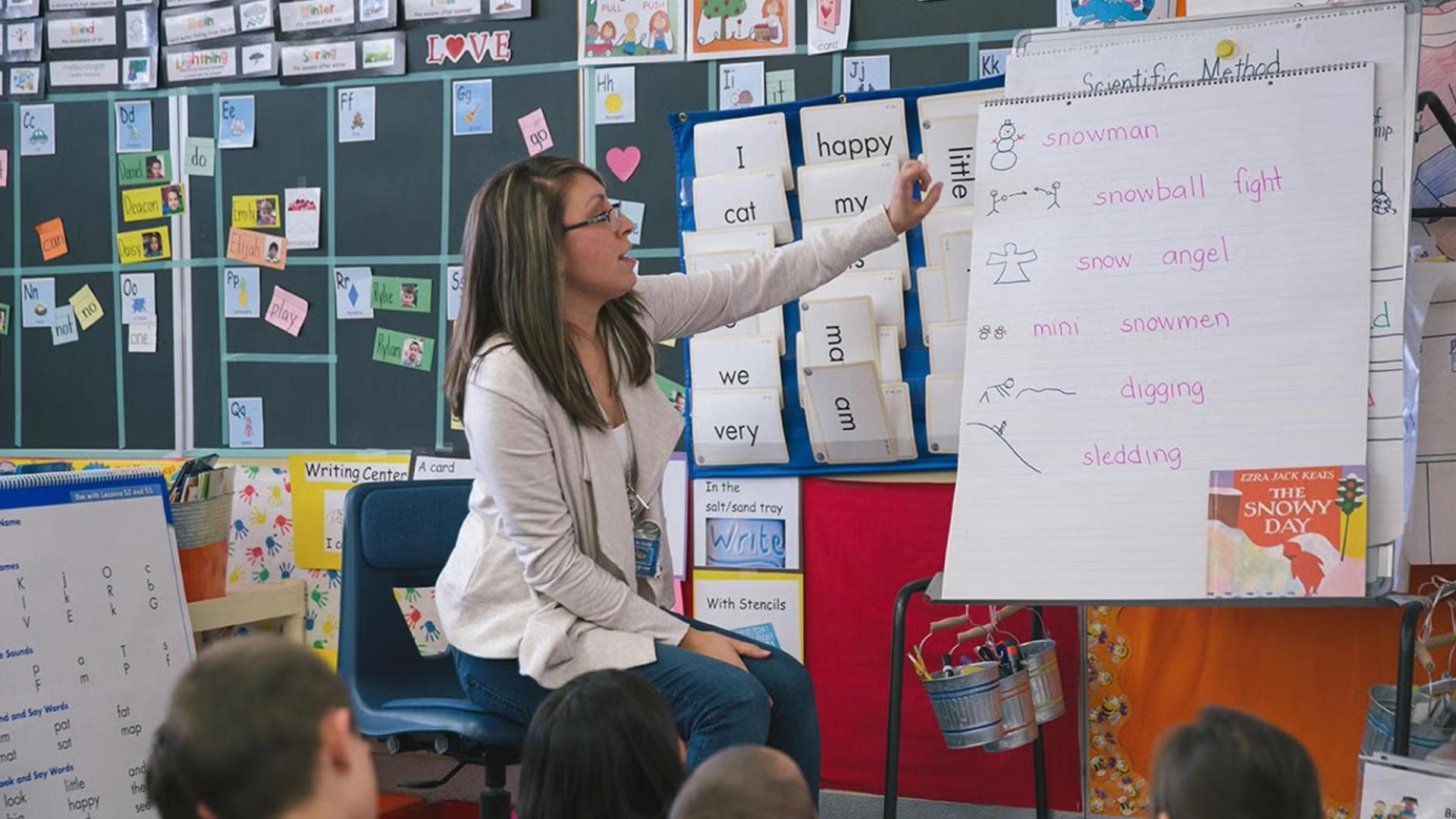 CU Denver education student working in the classroom with kids