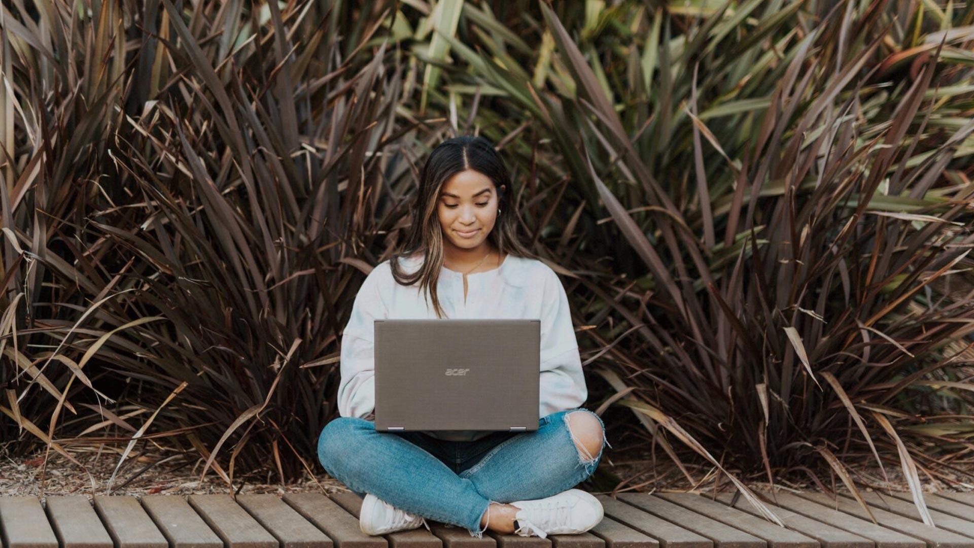 CU Denver online student working outdoors
