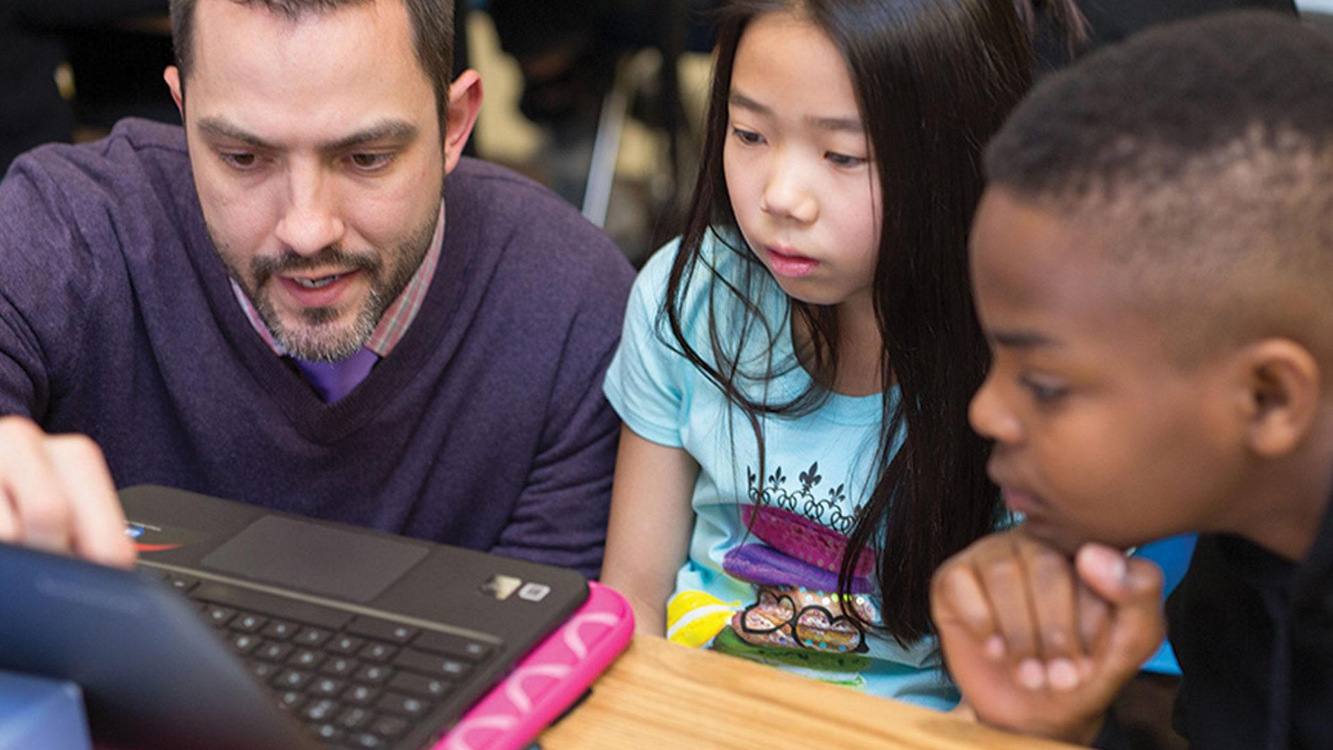 CU Denver student working with kids on reading