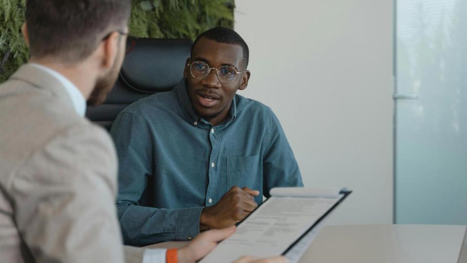 Accounting professional speaking with client