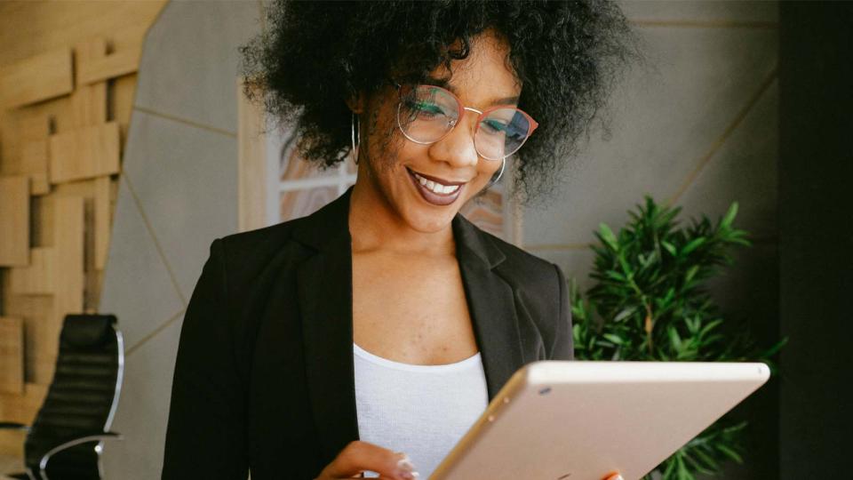 CU Denver student using a tablet device