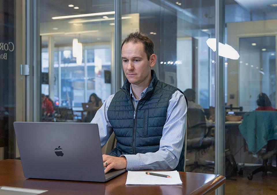 CU Denver student working in campus office